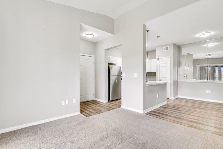 Empty apartment with wood style floors and carpet